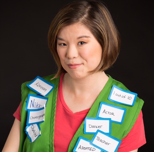 Nikki Abramson wearing a variety of nametags with different labels.